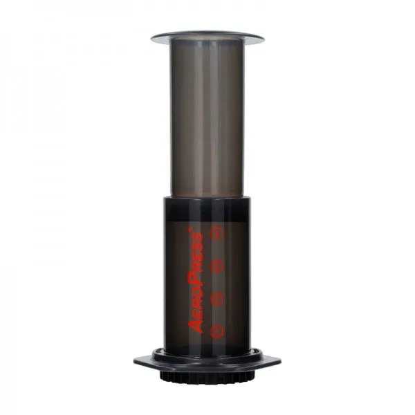 AeroPress manual coffee maker with cylindrical chamber, plunger and filter cap on a white background