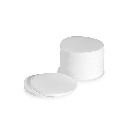 Stack of 350 white AeroPress paper coffee filters with several circular filters in front