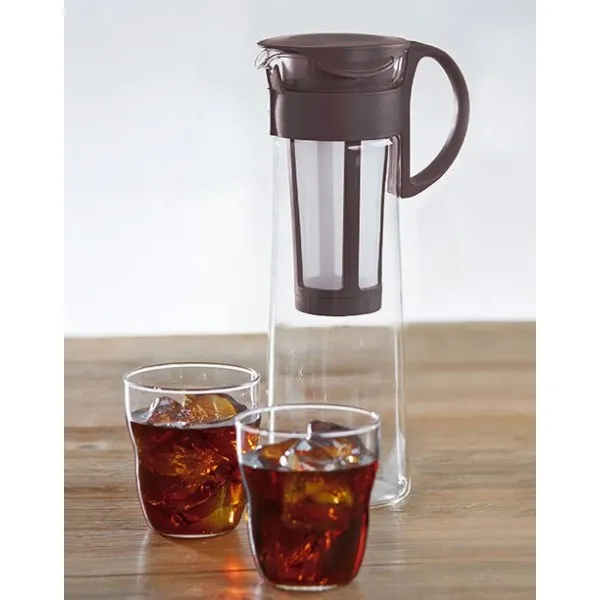 Hario Mizudashi cold brew coffee maker with two glasses of iced coffee