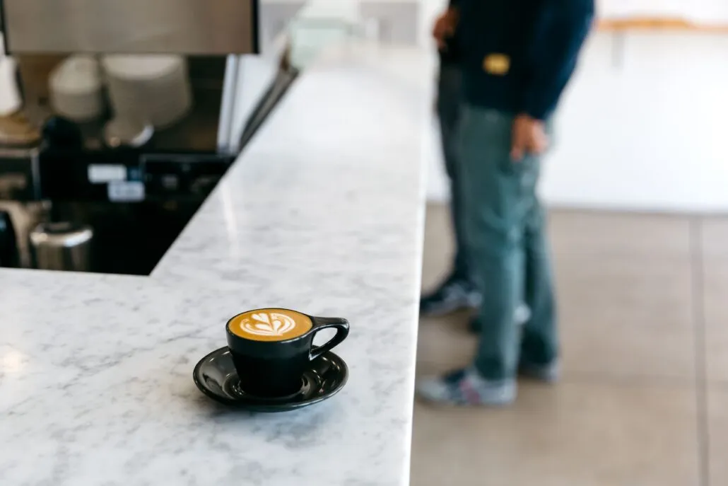 Black notNeutral Lino Espresso cup with coffee on a café counter