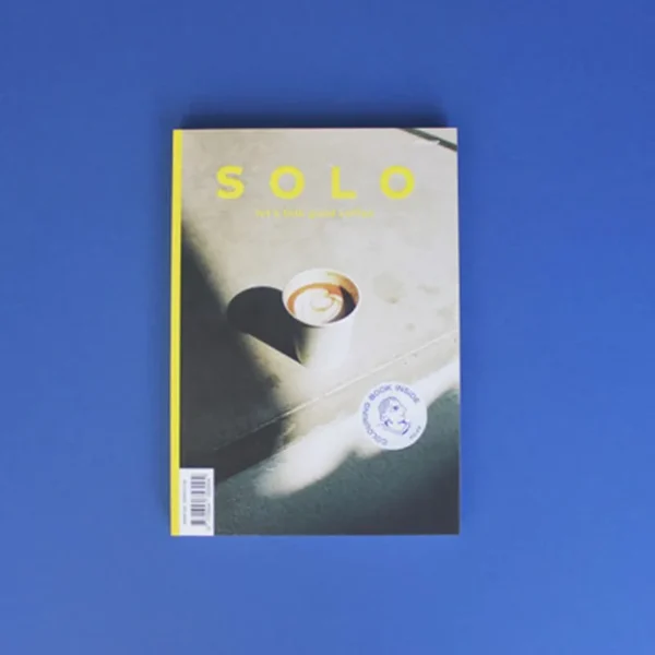 Cover of Solo Magazine issue 6 featuring a cup of coffee on a blue background